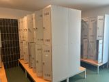 several lockers are lined up in a row in a room