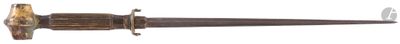 a close up of a knife on a white surface