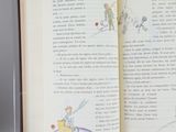 an open book with a drawing of a man on it