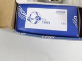 a box with a watch inside of it on a table