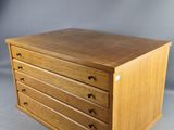 a wooden chest of drawers with five drawers on each side