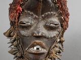 an image of a close up of a mask on a stand