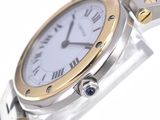 a silver and gold wrist watch with a white face