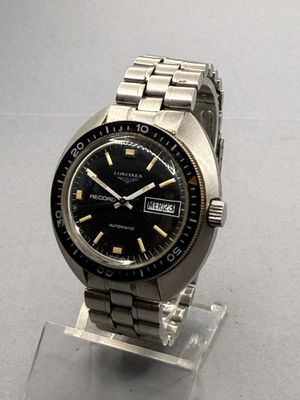 a watch that is sitting on a stand on a table