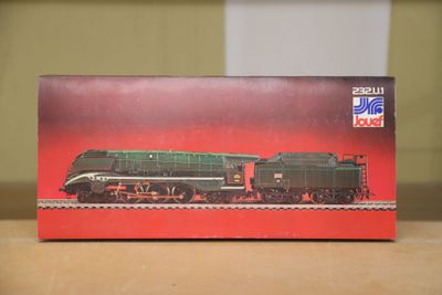 a box that is sitting on a table with a train on it