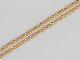 un bracelet en chaîne d'or avec deux boucles et un fermoir