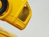 a close up of a yellow toy truck with a speaker on it