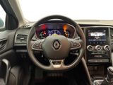 the interior of a car with a steering wheel and dashboard controls
