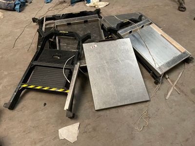 a pile of assorted metal items on the ground