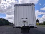 a white truck that is parked in the parking lot