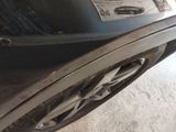 a close up of a car ' s exhaust pipe with a sticker on it