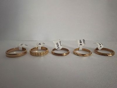 five different types of wedding rings are shown in a row