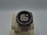 a watch sitting on a stand on a white surface