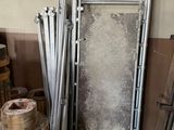 a pile of wood and metal items in a room
