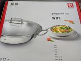 a box with a wok and a bowl of food on it