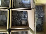 several boxes of assorted electronic components are stacked on top of each other
