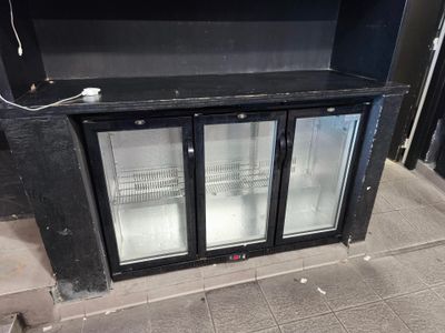 a black cabinet with two glass doors on the outside