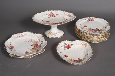 several plates and bowls are stacked on top of each other on a table