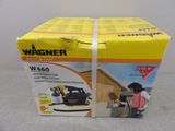 the box is open to show the contents of a power washer