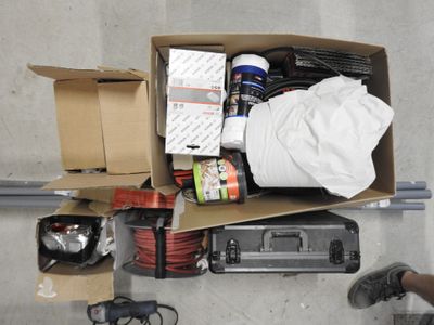 a box full of assorted items sitting on the floor