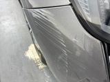 a close up of a car ' s side door with a sticker on it