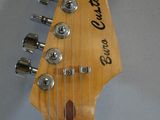 a close up of an electric guitar with a headstock and neck