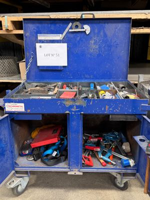 a blue work bench with tools in it