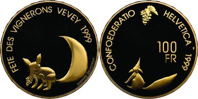 a close up of a coin with a picture of a cat on it