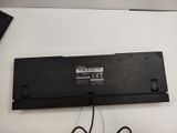 a laptop that is sitting on a table with a cord