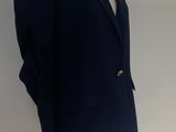 navy blue blazer jacket on a mannequin base