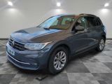 a blue volkswagen suv parked in a room with a checkered floor