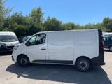 the white van is parked in a parking lot with other vehicles
