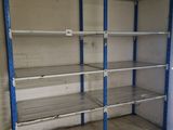a empty room with shelves in the middle of it