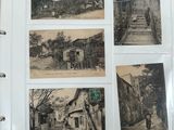 an old photo album with a bunch of old photos on it