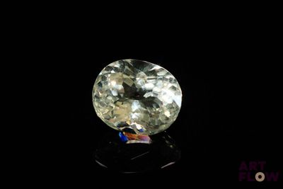 a close up of a diamond on a black surface