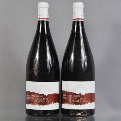two bottles of wine sitting on top of a table next to each other