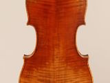 an old violin with a wooden back and a long neck