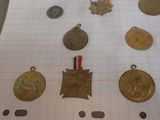 a lot of medals that are on a piece of paper