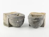 pair of gray stone bowls with handles on a white background