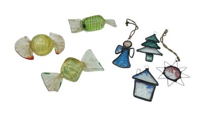 a group of glass ornaments on a white surface