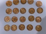 a lot of coins that are on the table
