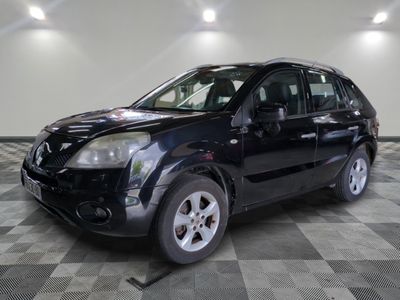 a picture of a black car parked in a garage