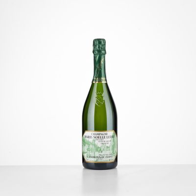 a bottle of champagne sitting on top of a table