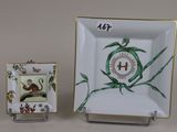 a small plate with a picture of a mouse on it and a small plate with a picture of a mouse on it