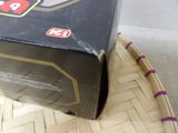 a box of pizza sitting on top of a wicker basket