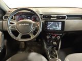 the interior of a car with a steering wheel and dashboard controls