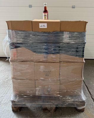 a pallet with several boxes on it in a warehouse