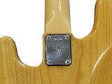 a close up of an electric guitar with a wooden body