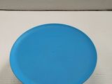 a blue frisbee sitting on top of a white table