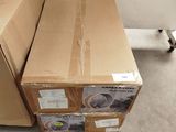boxes are stacked on top of each other in a room